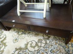 Darkwood coffee table with drawers under