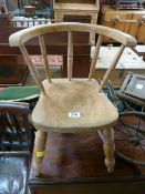 A childs small pine chair