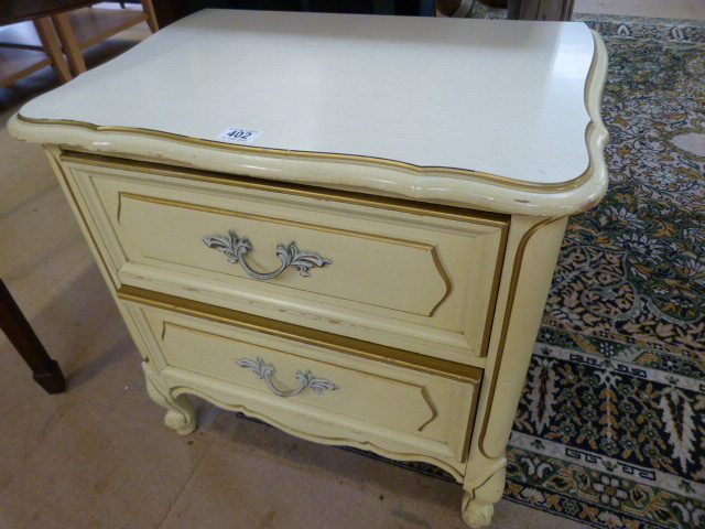 A painted regency style bedside chest of drawers