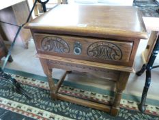 A Small occasional table with drawer under