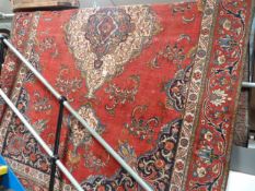 Large red ground Iranian rug