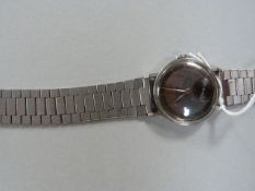 1950's Omega gentlemans stainless steel wristwatch with dark face and gold hands, subsidiary seconds
