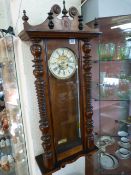 A Viennese wall clock- pendulum, key etc. in office