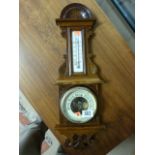 Carved oak barometer