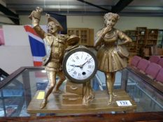 Gilt mantle clock depicting Musicians with replacement movement