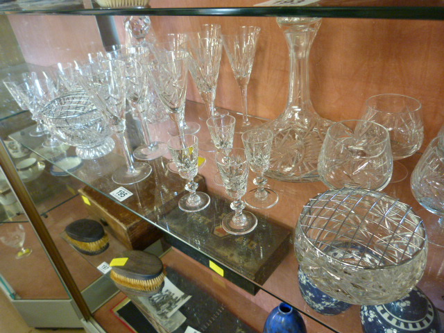 Two cut glass decanters and a part suite of glasses