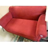 A red upholstered drop arm Sofa