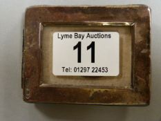 A small hallmarked silver photo frame