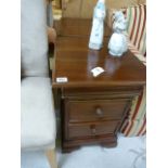 A pair of mahogany three drawer bedside cabinets