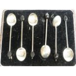 A cased set of hallmarked silver coffee bean spoons