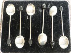 A cased set of hallmarked silver coffee bean spoons