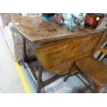 An antique oak gateleg table