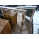 A pair of large silver framed mirror