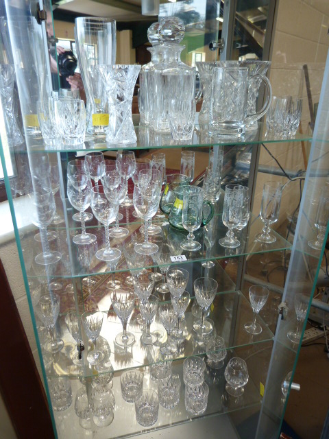 A Stuart Crystal suite of glasses and various other glassware - 4 shelves