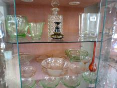 A quantity of coloured glass inc uranium glass - 2 shelves