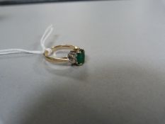 Emerald and diamond ring set in 9ct gold