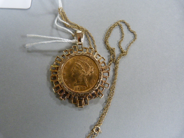 An American gold $5 piece with Liberty head set in 9 ct mount and chain- total weight 12.9g