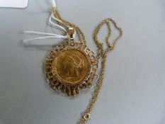 An American gold $5 piece with Liberty head set in 9 ct mount and chain- total weight 12.9g