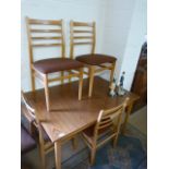 Teak extending table with four chairs