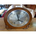 An oak cased Art Deco chiming mantle clock by Garrard- key in office