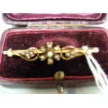 A 15ct gold bar brooch decorated with seed pearls - weight 3.4g