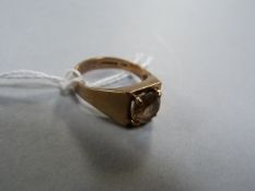 A 9ct gold ring with a smoky Topaz