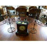 A Mantle Clock and two metal candle holders