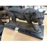 A bronze of a Tiger on plinth