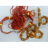 A Coral Necklace, an amber style necklace and one other