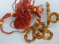 A Coral Necklace, an amber style necklace and one other