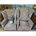 A "His & Hers"pair of wing back armchairs