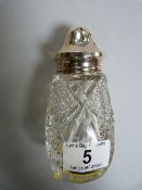 Cut glass sugar shaker with silver top