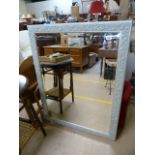 A large framed hall mirror