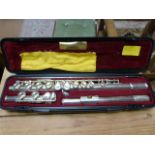 A cased Yamaha silver plated flute