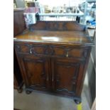 An oak Jacobean style sideboard by Merryweather & Sons