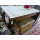 An oak drawer leaf table and six barley twist chairs