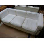 A White leather and chrome sofa