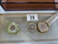 A Perspex jewellery box and two swatch watches etc