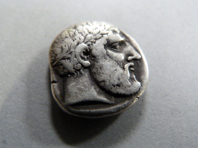 A silver Stater coin - marked CC to rim