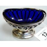 Solid silver salt with original dark blue glass insert. Hallmarked Birmingham.