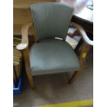 An upholstered oak framed captains chair