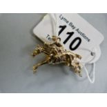 A hallmarked 9ct gold horse and jockey pendant- weight11.8g