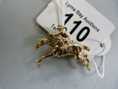A hallmarked 9ct gold horse and jockey pendant- weight11.8g