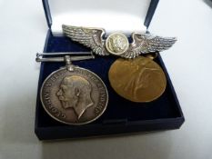 2 WW1 medals awarded to Private T Swinden ( Border Regt.) and a winged badge