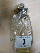 Cut glass sugar shaker with silver top