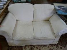 Large 2 seater cream sofa with extra loose covers