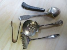 A hallmarked silver spoon, sugar tongs etc