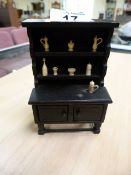 Miniature oak dresser with carved ivory bottles, cups etc. circa 1890