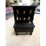 Miniature oak dresser with carved ivory bottles, cups etc. circa 1890