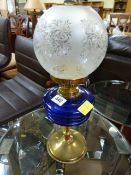 An oil lamp with blue glass well